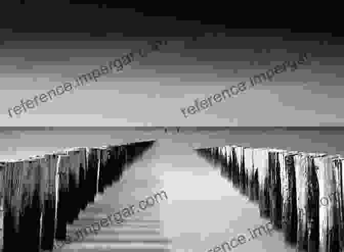 A Black And White Photograph Of A Seaside Pier Stretching Into The Distance, Capturing The Serene Beauty And Timeless Elegance Of These Seaside Landmarks Walking Over The Waves: Quintessential British Seaside Piers