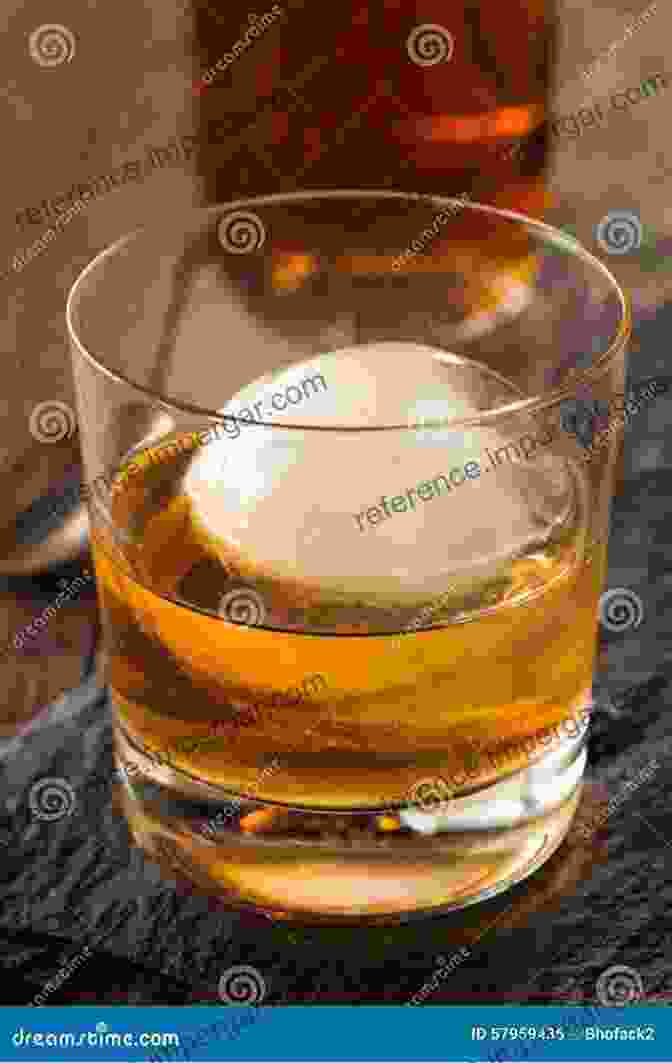 A Glass Of Bourbon With Ice Cubes And An Orange Slice Bourbon Is My Comfort Food